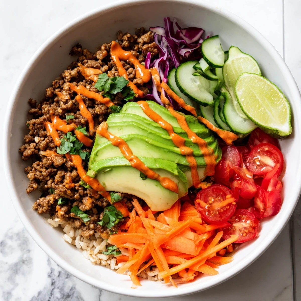 Wholesome plant-based meat bowl, drizzled with spicy mayo and garnished with cilantro.