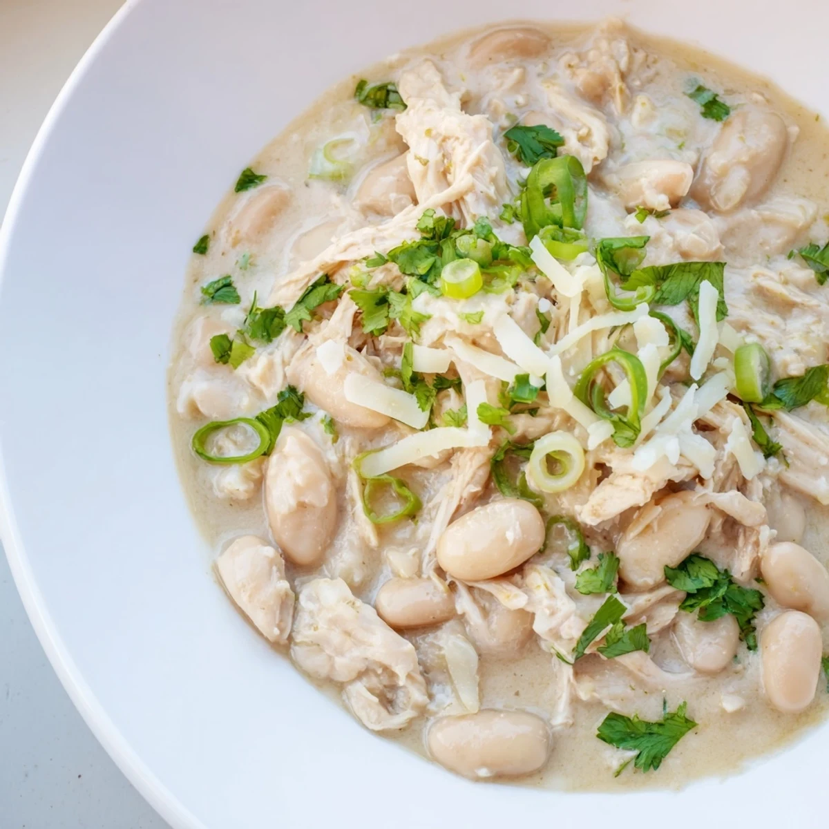 Savory Creamy White Chicken Chili ready to serve, a comforting Southwestern dish with beans.