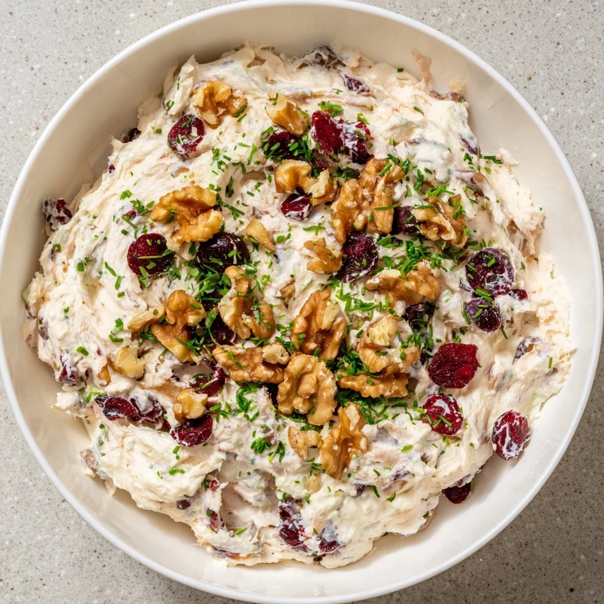 Delicious scoopable Lightened Holiday Cream Cheese Dip, perfect appetizer with crackers, featuring fresh green onion.