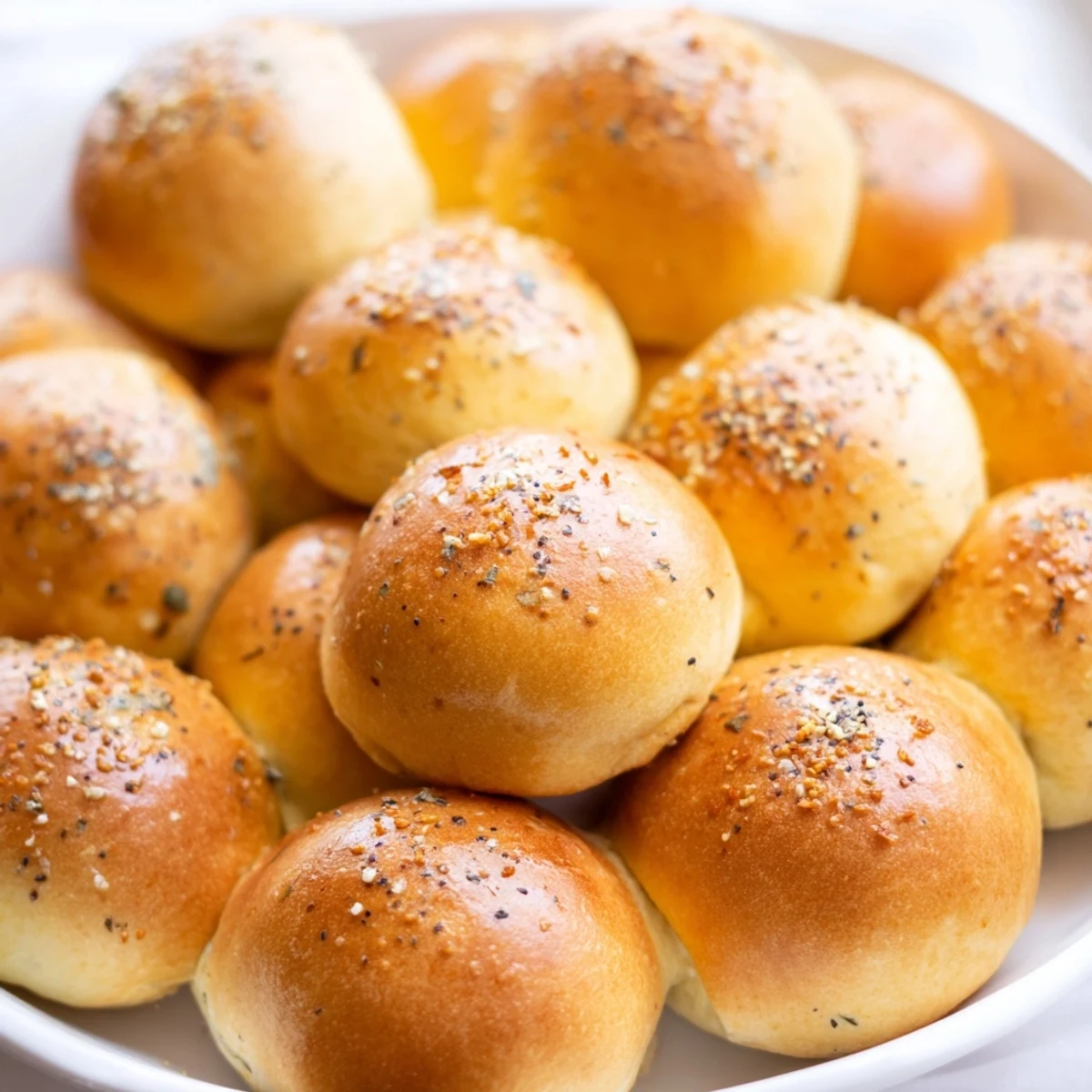 A close-up of The Cobblestone Courtyard appetizer, showcasing colorful olives nestled among crackers.