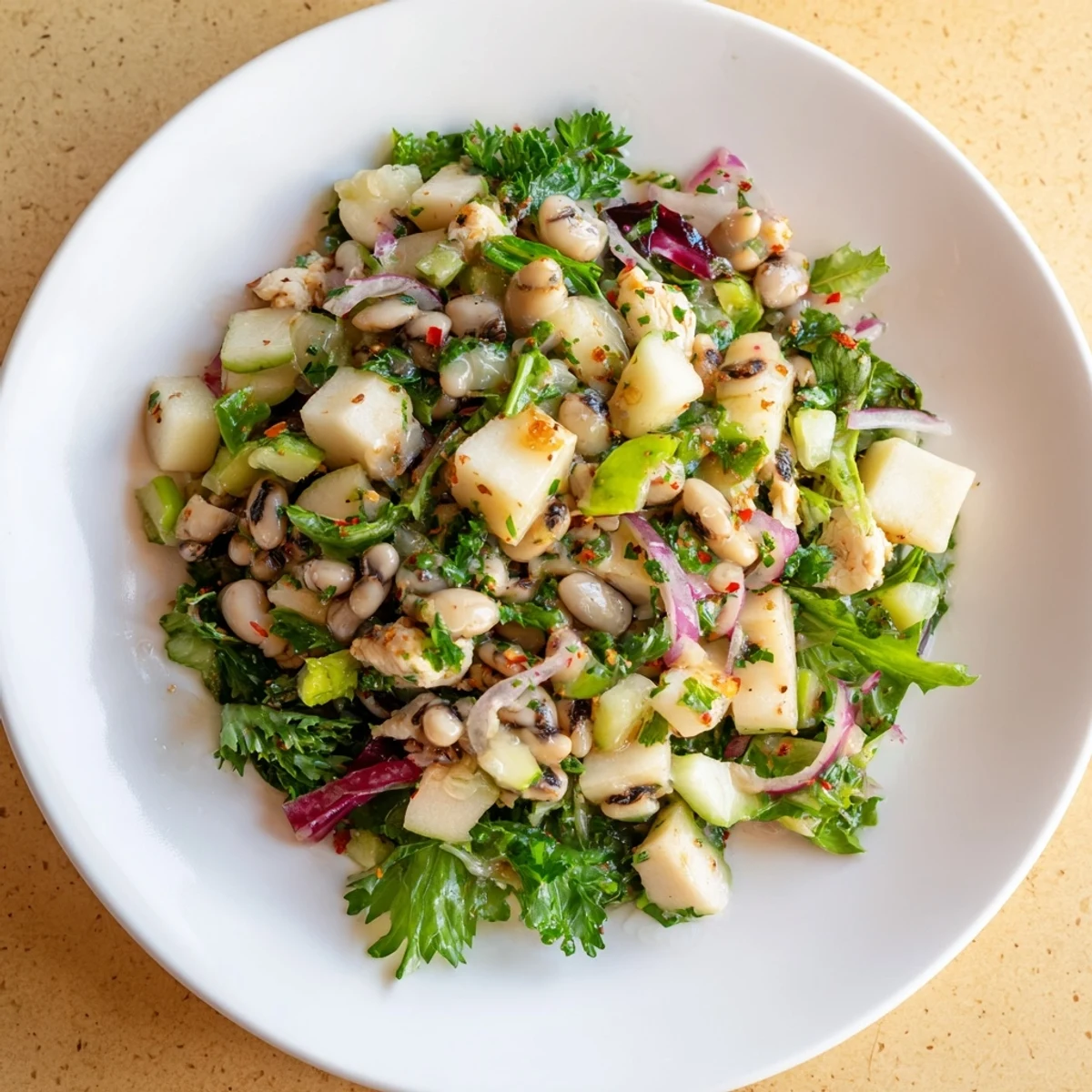 This Chicken and Apple New Years Luck Salad displays vibrant colors, with tender chicken and crunchy apples.