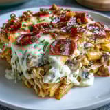 Golden, bubbly mozzarella and crispy pepperoni top a hearty High-Protein Pizza Pasta Bake fresh from the oven.