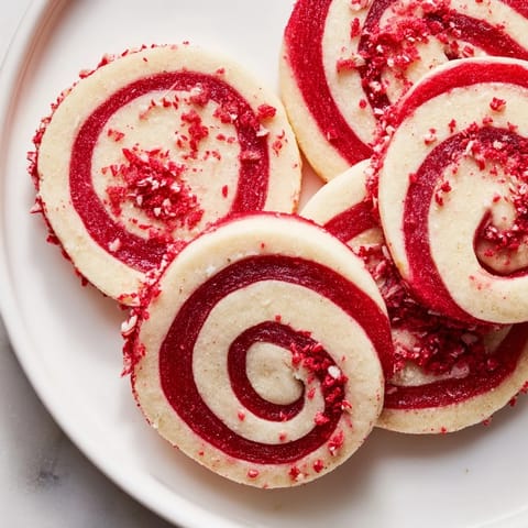 Beautifully swirled Candy Cane Pinwheel Cookies, with a festive peppermint aroma and a delightful sweet taste.