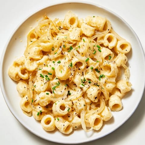Delectable Creamy French Onion Ditalini: caramelized onions create a rich sauce enveloping the ditalini pasta.