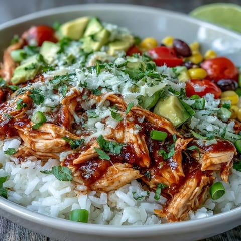 Vibrant salsa chicken bowls with shredded chicken, rice, black beans, and fresh toppings for a healthy, gluten-free meal.