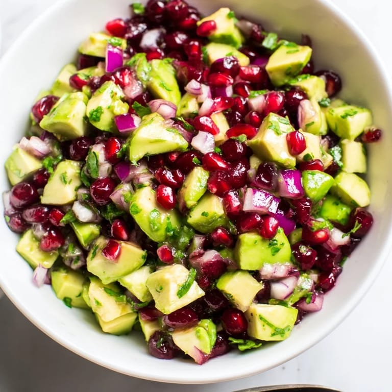 Deliciously zesty Cranberry Jalapeño Avocado Salsa as a colorful topping for grilled dishes.