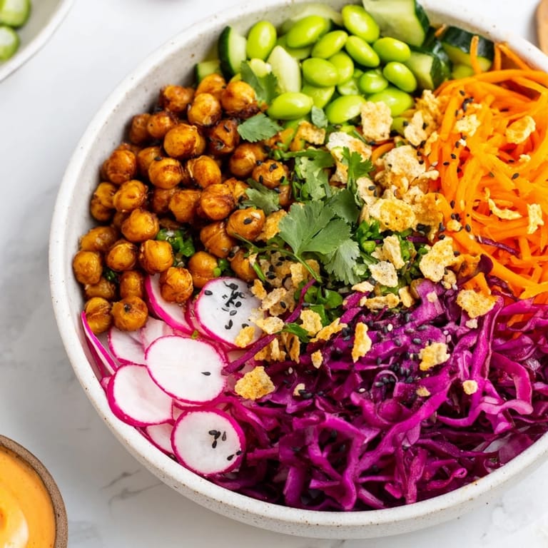 Vibrant ASMR Crunch Snack Bowls topped with crispy chickpeas and rainbow carrots.  