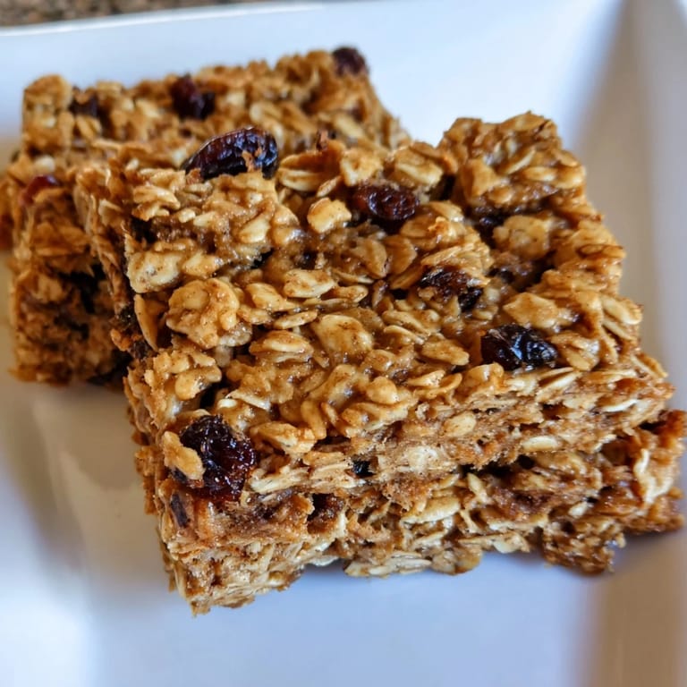 Fresh-baked maple cinnamon oatmeal bars, served on a plate ready to enjoy as a flavorful snack.