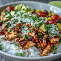 Vibrant salsa chicken bowls with shredded chicken, rice, black beans, and fresh toppings for a healthy, gluten-free meal.